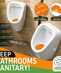 Image of two urinals with Ten Pack Long Lasting Orange Scent Urinal Screens Deodorizers With Splash Control Tech in use.