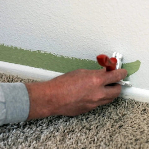 Person using Pack Of 2 Edger Shield For Baseboards And Uneven Trim, Paintbrush Not Included, Attaches To Any 2 Inch Brush