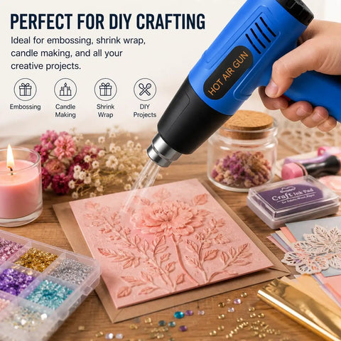 Powerful 900W Heat Gun with Dual Temperature Settings used on pink embossing project surrounded by crafting materials