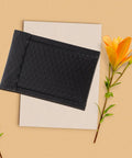 Black Padded Bubble Mailer Envelopes 12x18 on table with yellow flower decor