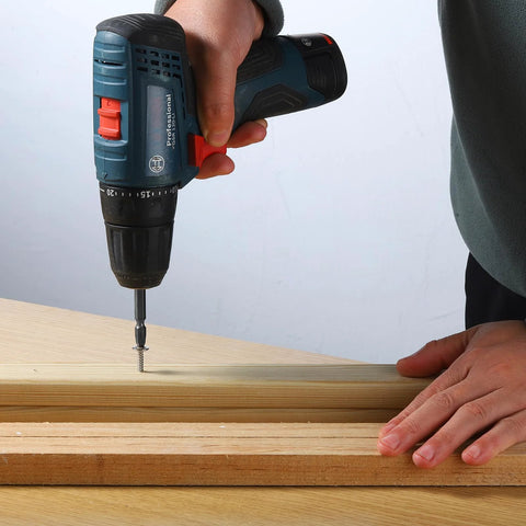 Person using a drill to drive a wood screw set no 8 x 1 inch phillips modified truss head self tapping stainless steel 410 into wood