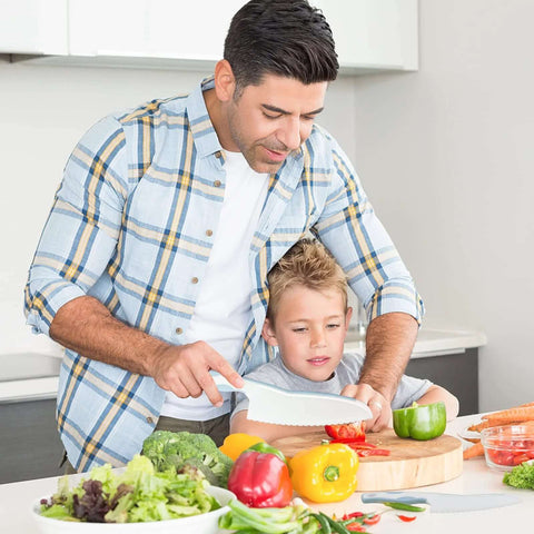 Blue RISICULIS wooden kids knife set on cutting board; includes plastic toddler knife and assorted kid-friendly kitchen tools