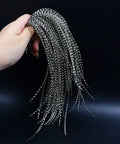 Hand holding Grizzly Dyed Black and White Fly Tying Feathers Saddle Hackles for Dry Flies, 9-11 Inch Length, Midge Rooster Feathers