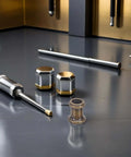 Grab These 8pcs Long Thread Lamp Pipe Couplers Made Of Heavy Duty Zinc To Join Light Fixture Connectors And Extend Pendant Rods With Ease For Any Home Glow Project. zinc lamp couplers on tabletop, shown with threaded rods and connector ends