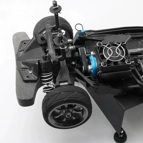 Radio Control Car Transmission Upgrade Kit With Low Noise Belt Drive Conversion For TT02 1 To 10 Scale Radio Control Cars CNC Machined Gears System Durable High Precision Parts To Boost Power Transfer And Smooth Shifts. RC chassis close-up