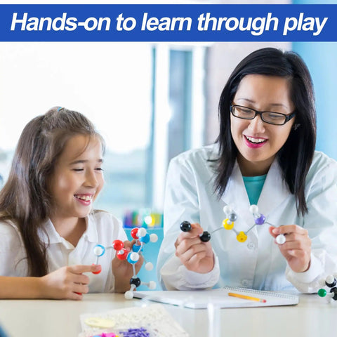 Teacher and student using Ultimate 297 Piece Chemistry Molecule Model Kit for hands-on learning, building 3D atom models.