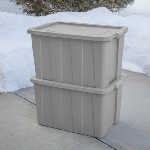 Tough As Nails 30 Gallon Storage Bins With Secure Lids Heavy Duty Plastic Totes Set Of 8 stacked gray bins on a snowy surface.