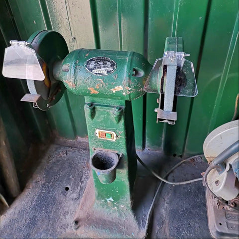 Bench grinder equipped with Eye Shield Replacement Kit For Most Bench Grinders, 2 Pack Plexiglass Safety Guards.