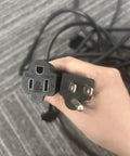 Two power plugs for the Kick Back In Style With This Heavy Duty 50 Ft Outdoor Extension Cord showing different outlet designs.