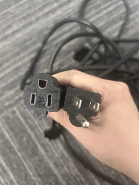 Two power plugs for the Kick Back In Style With This Heavy Duty 50 Ft Outdoor Extension Cord showing different outlet designs.