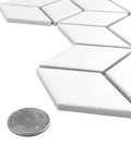 Metro Rhombus Matte White Porcelain Tile For Floor And Wall, 10.5 In By 12.13 In Mesh Mounted Mosaic with quarter for scale