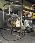 Portable 6000 watt generator on truck bed showing control panel and wheels for easy transport, suitable for outdoor power needs.