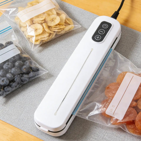 4 Piece Nichrome Heating Strip Replacement For Vacuum Sealer Machine 337mm Seal Element Bar With Even Heat Distribution For Food Packaging Bags And Shrink Film Sealing Upgrades Your Gear on a table with sealed bags of snacks.