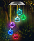 Solar Disco Ball Garden Light With Color Changing LEDs For Outdoor Patio Decor at night with vibrant mosaic balls