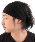 Side view of a model wearing No Slip Sweat Wicking Headband For Men Japanese Style Bandana Black Size M Elastic Fit For Active Movement