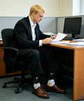 Man wearing Crazy Colorful Mens Dress Socks For Men Size 8 To 12 Crew Length Dope Patterned Dress Socks That Stand Out At Work.