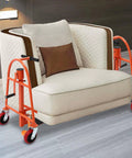 Beefy Heavy Duty Furniture Moving Dolly Set With Wheels, 12 Inch Lift Height, Dual Pack Of 2, Durable Steel Construction, Nylon Straps, Red, Ideal Machinery Mover For Sofas, Cabinets, Appliances And Heavy Objects. Red dolly set lifting a sofa