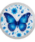 Close-up of a glass cabinet knob featuring a blue butterfly and flowers, part of the 4 Pack Blue Butterfly and Flower Crystal Glass Cabinet Knobs for Kitchen and Bedroom.