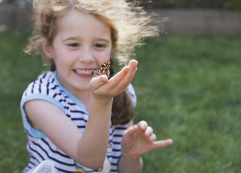 Child with butterfly from Two Cups Of Live Painted Lady Caterpillars Refill Kit With 10 Caterpillars And Food Plus Bonus Butterfly Life Cycle Figurines