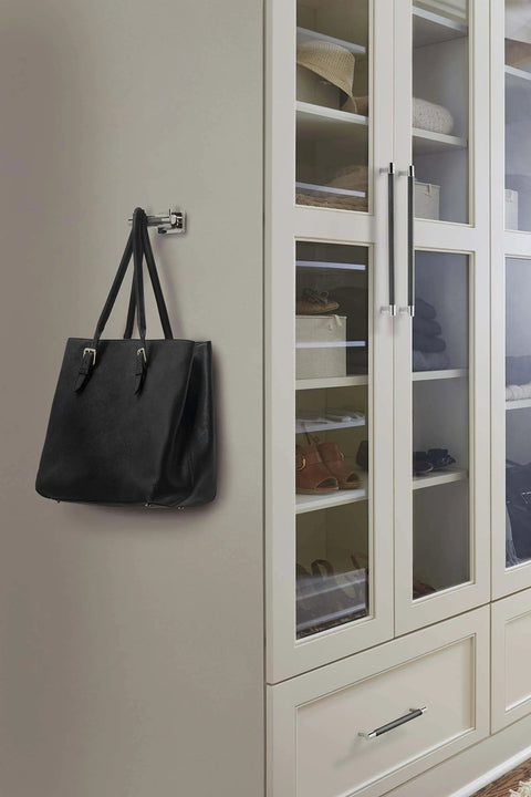 Contemporary 8-Inch Center-To-Center Cabinet Pull in Polished Nickel Gunmetal Finish installed on cabinet door with bag hanging.