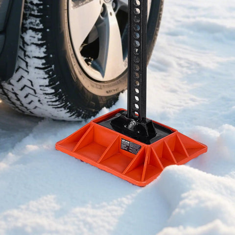 VEVOR High Lift Jack Base And Handle Keeper 11.6 Inch Off Road Support Stand in snow with truck tire, providing stable lift.
