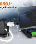 Flat Plug 12 In 1 Power Strip Tower With 8 AC Outlets 4 USB Ports 10 Ft Extension Cord Surge Protected beside laptop and phone