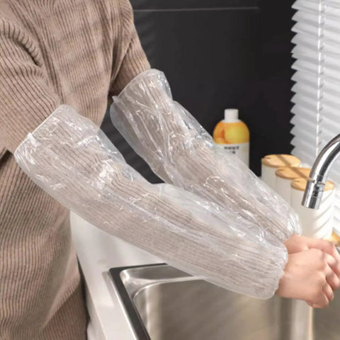 Person wearing Disposable Arm Sleeve Covers 200 Pack Clear Plastic Sleeves For Painting, Repairs, Cleaning, And Tattooing.