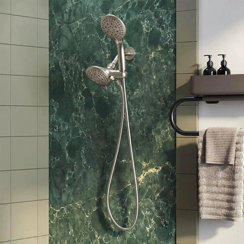 Brushed nickel Dual Shower Head Combo 2-in-1 Water Saving System with 59-Inch Stainless Steel Hose, mounted on green marble wall.