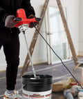 Person using Beefy 2300W Portable Electric Cement Mixer With 6 Adjustable Speeds Handheld Paint Mixer for DIY projects.