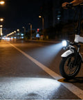 High Visibility E Bike Horn Front Light With 3 Pin Connector And Built In Horn illuminating a city street at night