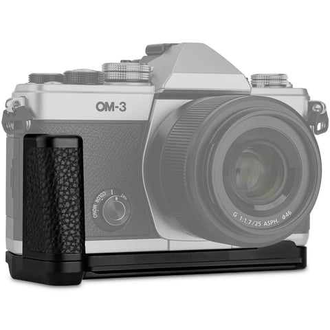 OM System OM 3 Hand Grip Camera Bracket With Arca Swiss Interface shown on an OM-3 camera, textured leather grip detail