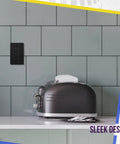 No Sweat Install Hella Sleek Matte Decorator Wall Outlet 15 Amp Electrical Receptacle mounted above a toaster on a kitchen counter.