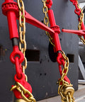 Ratcheting Chain Binders With Grab Hooks 1/4-5/16 Inch, 2,200 LBS Working Load in use on industrial chains, close-up view