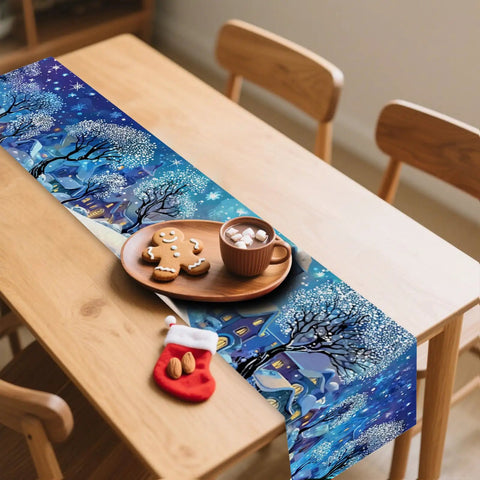 Cozy Linen Christmas Table Runner With Blue Snowy Village Winter Scene For The Fam And Family Holiday Gatherings 13x72 Inches 2D Printed Tabletop Decor That Brings Festive Winter Vibes displayed on wooden dining table with cookies and cocoa