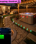 Outdoor setup with 30 Pack 1.22 Inch Low Voltage RGBW Deck Lights with WiFi App, IP67 waterproof, black housing illuminating pathway