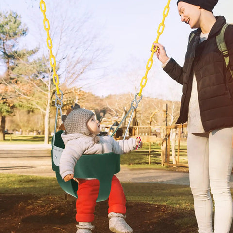 Kid Friendly Toddler Swing Seat With Coated Chains And Heavy Duty High Back Bucket For Outdoor Backyard Play Includes Tree Straps And Hooks For Swing Sets, child seated in green swing with yellow chains, woman assisting.