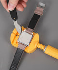 Person using Pro Grade Watch Back Opener Tool And Case Knife With 20mm Fit Aluminum Handle Bezel Removal Tool for watch repairs.