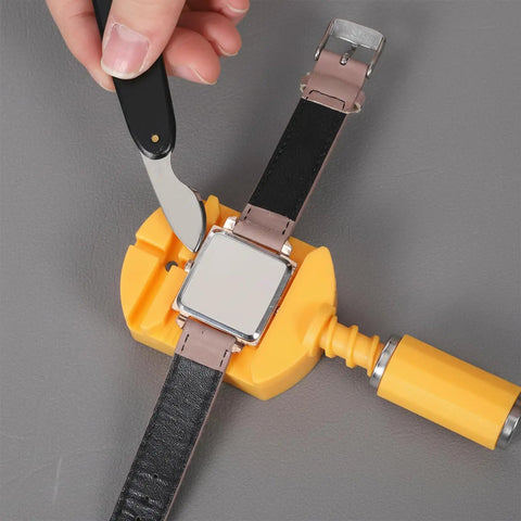 Person using Pro Grade Watch Back Opener Tool And Case Knife With 20mm Fit Aluminum Handle Bezel Removal Tool for watch repairs.