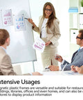 Business meeting with charts displayed using 15 Pack Magnetic Sign Holders For 8.5 By 11 Documents on a whiteboard.