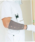 Heavy Duty Cut Resistant Wrist Sleeves For Men And Women Beefy Arm Guards Featuring Snag Free Flex and Abrasion Block Cover worn while leveling a door.