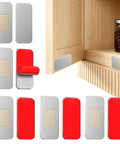 Six Pack No Drill Magnetic Cabinet Door Catch Kit with stainless steel adhesive magnets on a wooden cabinet door.