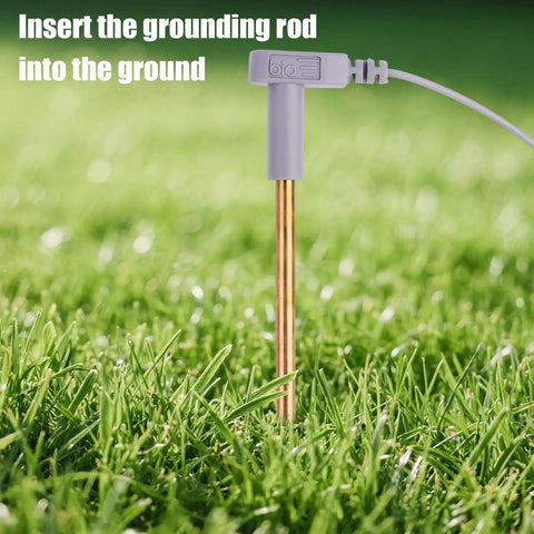 Copper Grounding Rod Kit With 40 Foot Female Cord And 15 Foot Male Wire inserted into ground for earthing mats and blankets.