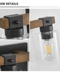 Close-up of Farmhouse 3 Light Vanity Fixture with rustic wood, clear glass shade, and metal base detail.