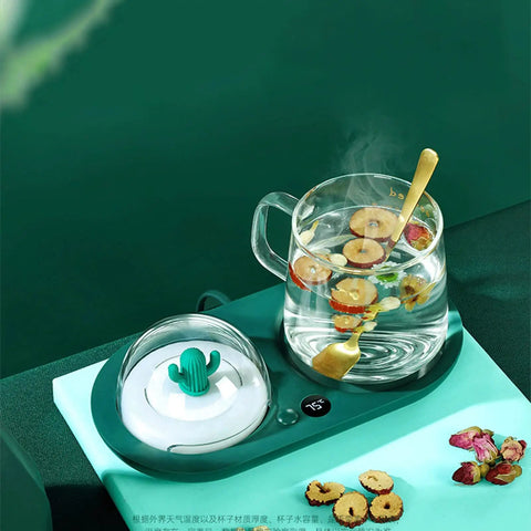 Smart Cup Warmer Heating Pad With Adjustable Temperature Controls Keeps Your Morning Drip Piping Hot All Day features a glass cup with herbs.