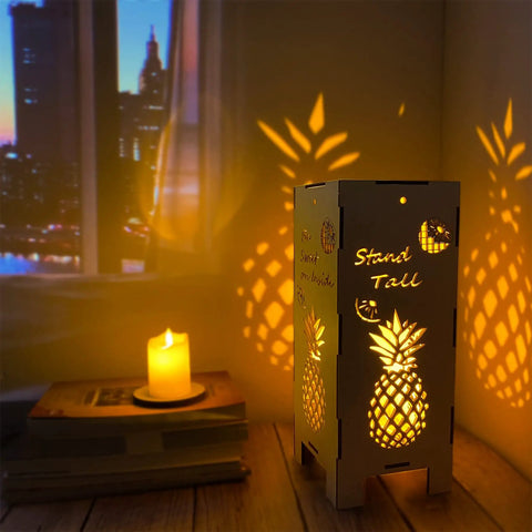 Cozy 13.5 Inch Pineapple Lantern Wooden Farmhouse Decor for indoor use, casting warm pineapple shadows in a dimly lit room