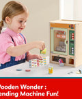 Child playing with Wooden Vending Machine Play Set For Kids Built For Realistic Pretend Shopping Fun With Snack Bars And Drink Cans
