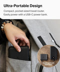 Person placing compact Portable Wi-Fi 6 Travel Router With AX1500 Dual Band For Hotel Or RV Use into bag