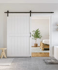 Rock Solid White Sliding Barn Door 48 X 84 Inches Smooth Glide Hardware Kit Primed Mdf Pvc Core in modern interior setting.