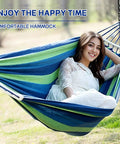 Beefy Heavy Duty Two Person Camping Hammock With 660 Lb Capacity, woman relaxing, blue and green fabric, outdoor setting