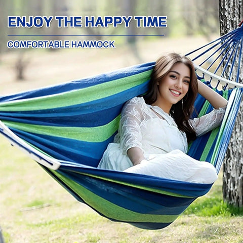 Beefy Heavy Duty Two Person Camping Hammock With 660 Lb Capacity, woman relaxing, blue and green fabric, outdoor setting